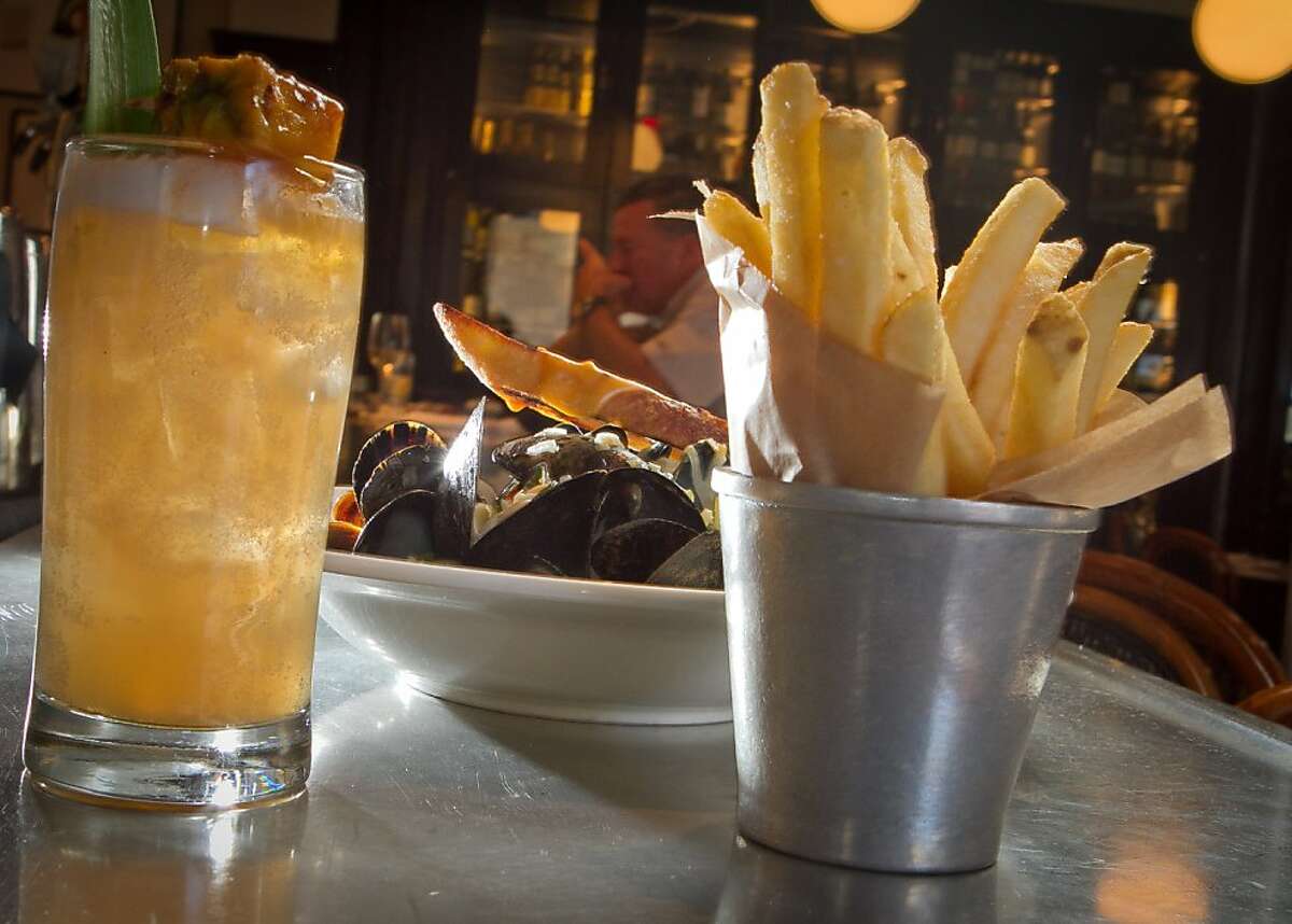 The Moules Frites with the Zombie cocktail at Cafe Des Amis in San Francisco, Calif., is seen on Tuesday, November 1, 2011.