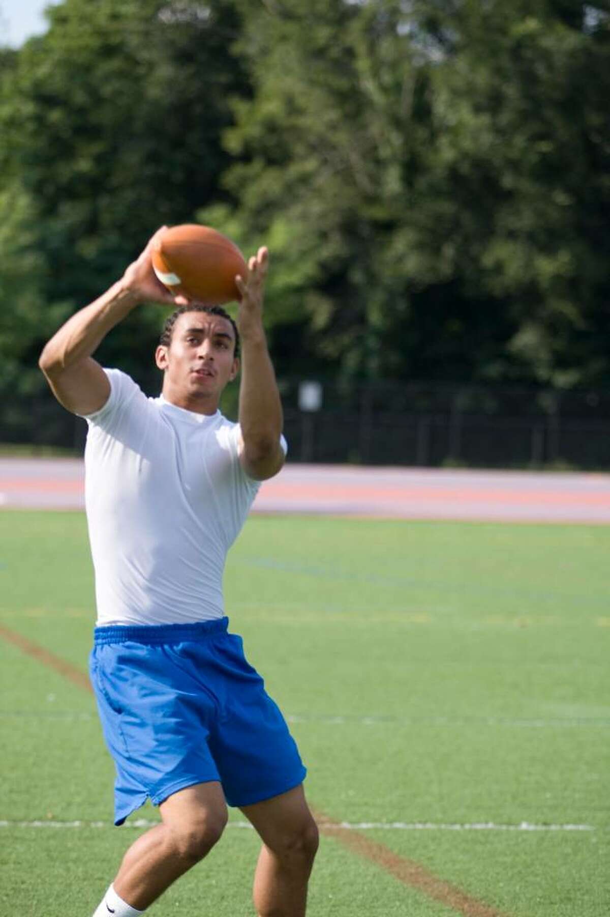 Danbury High receiver Damian Winters grabs a pass during practice.