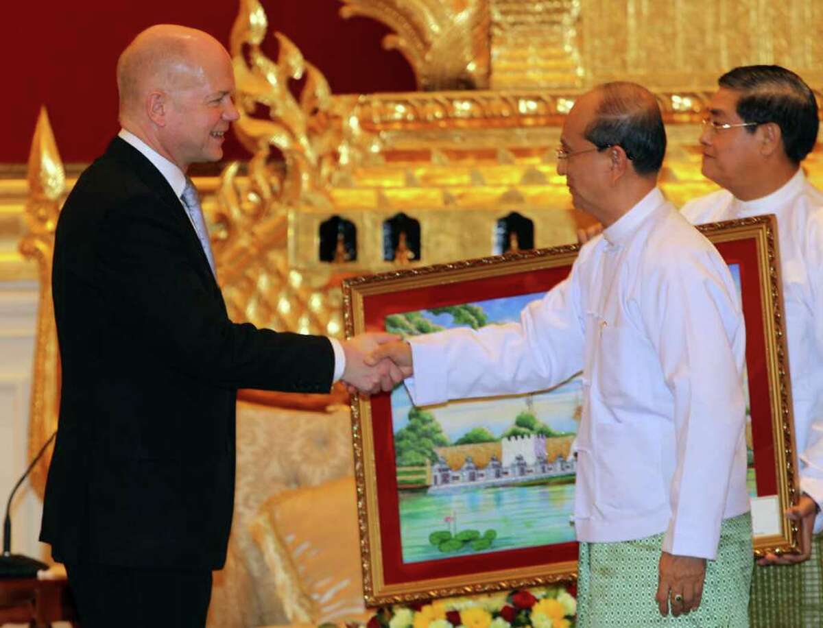 British Foreign Secretary William Hague, left, shakes hands with Myanmar's President Thein Sein during their meeting at the presidential palace in Naypyitaw, Myanmar Thursday, Jan. 5, 2012. Hague is on the first day of his two-day visit to Myanmar. (AP Photo/Apichart Weerawong)