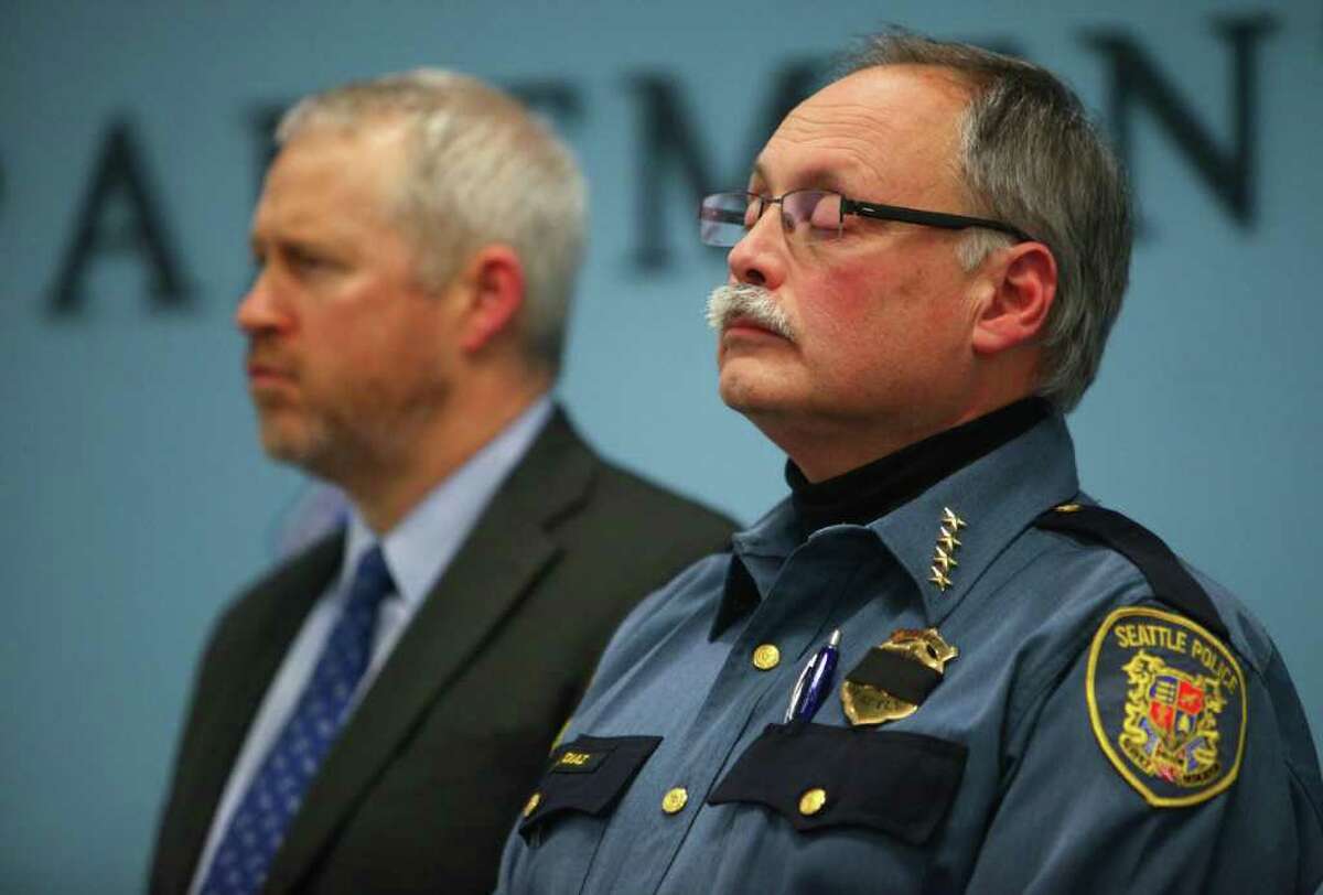 Seattle Mayor Mike McGinn and Police Chief John Diaz speak to reporters after announcing that Officer Richard Francis Nelson died from a self-inflicted gunshot wound after the veteran officer was arrested for mishandling drug evidence on Thursday, January 5, 2011.