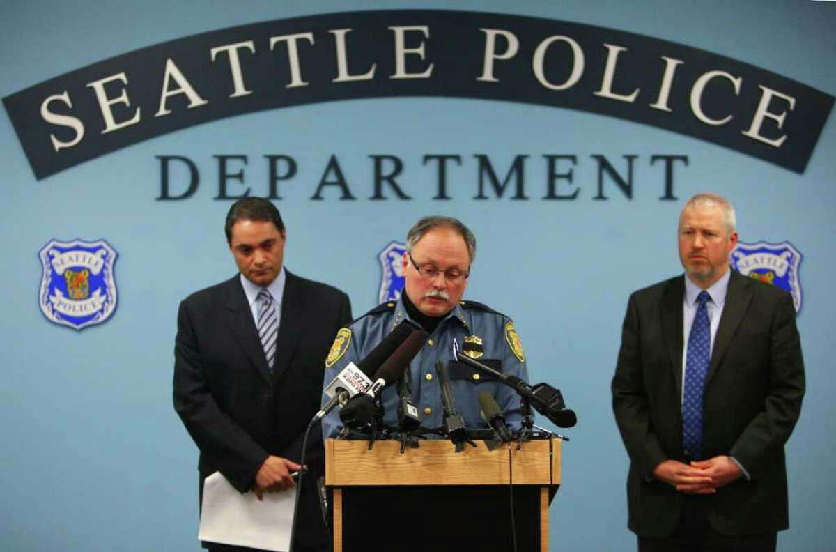 Deputy Chief Nick Metz, Police Chief John Diaz and Seattle Mayor Mike McGinn speak to reporters after announcing that Officer Richard Francis Nelson died from a self-inflicted gunshot wound after the veteran officer was arrested for mishandling drug evidence on Thursday, January 5, 2011.