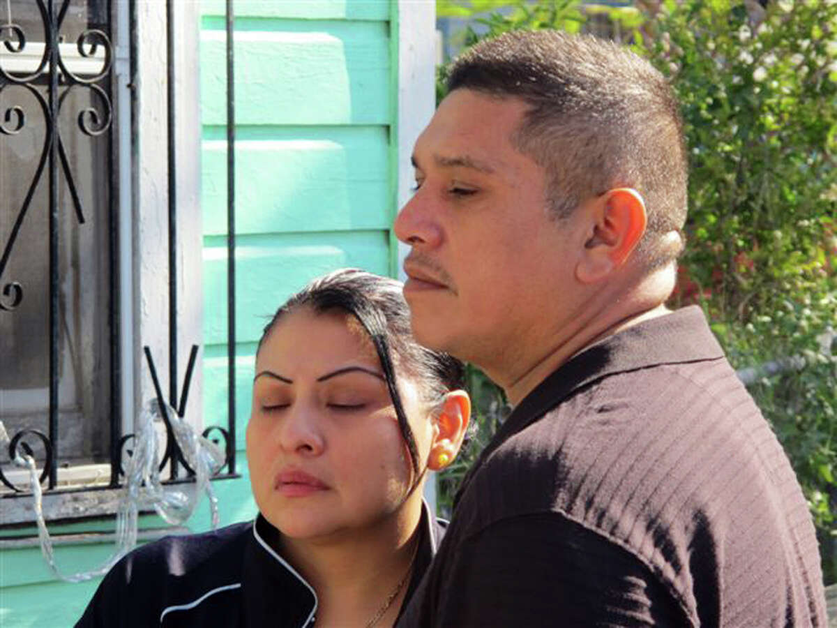 Jaime Gonzalez's parents, stepmother Noralva Gonzalez and Jaime Gonzalez Sr., speak in front of their home Thursday. "Why was so much excess force used on a minor?" the father asked.