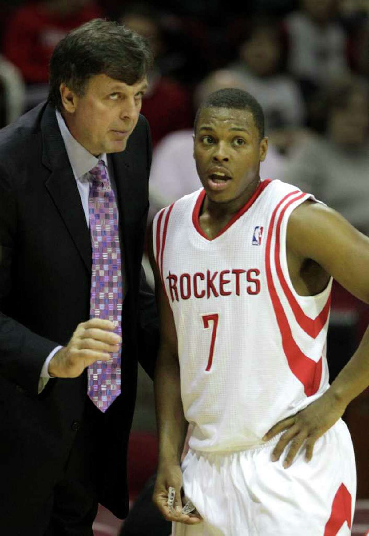 Houston Rockets head coach Kevin McHale, left, talks to Rockets point guard Kyle Lowry (7) during the first half of a pre-season NBA basketball game against the San Antonio Spurs at Toyota Center Saturday, Dec. 17, 2011, in Houston. ( Brett Coomer / Houston Chronicle )