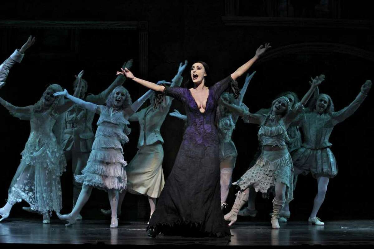 Sara Gettelfinger (Morticia) and Company in THE ADDAMS FAMILY. (