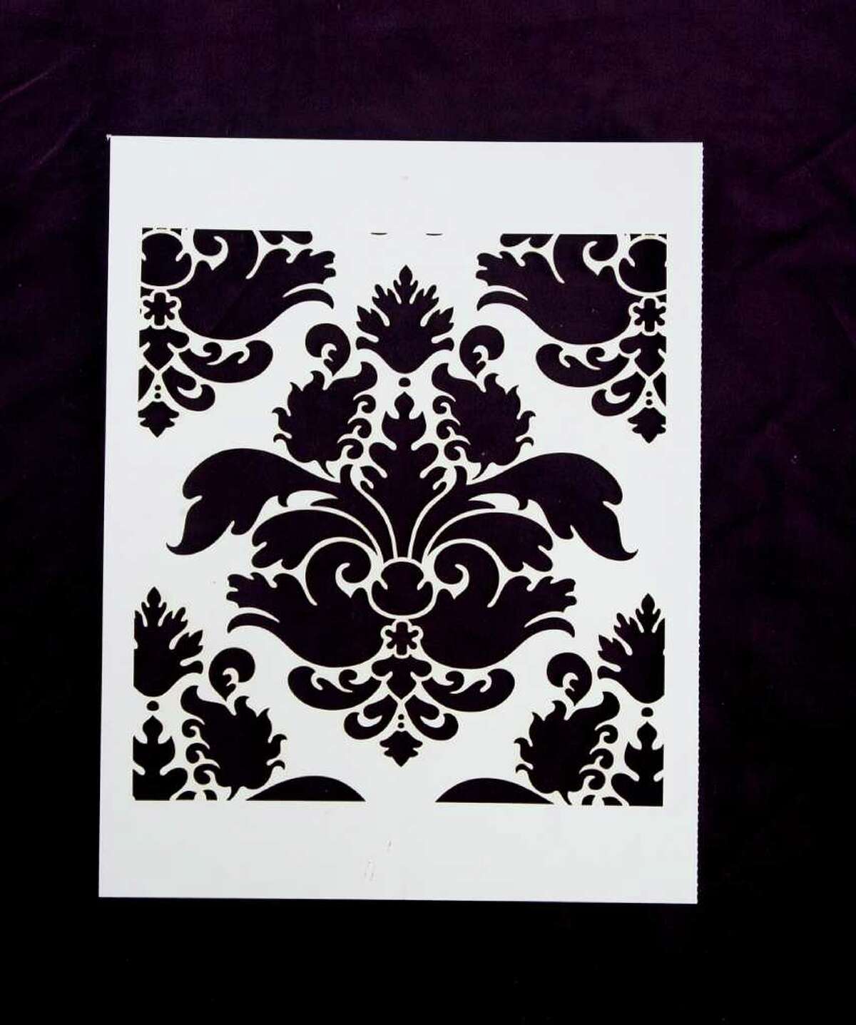The card-stock stencils from Stencil It ($29.99, St. Martin Griffin), include a damask design.