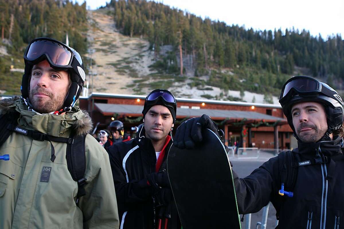 Enrique Acevedo (middle) and Nicolaus Ibarguen (right) coming off the slopes of Heavenly Valley ski resort in South Lake Tahoe, Calif., on Wednesday, January 4, 2012. Gunbarrel ski run is behind them as 26 ski runs out of the normal 97 are running.