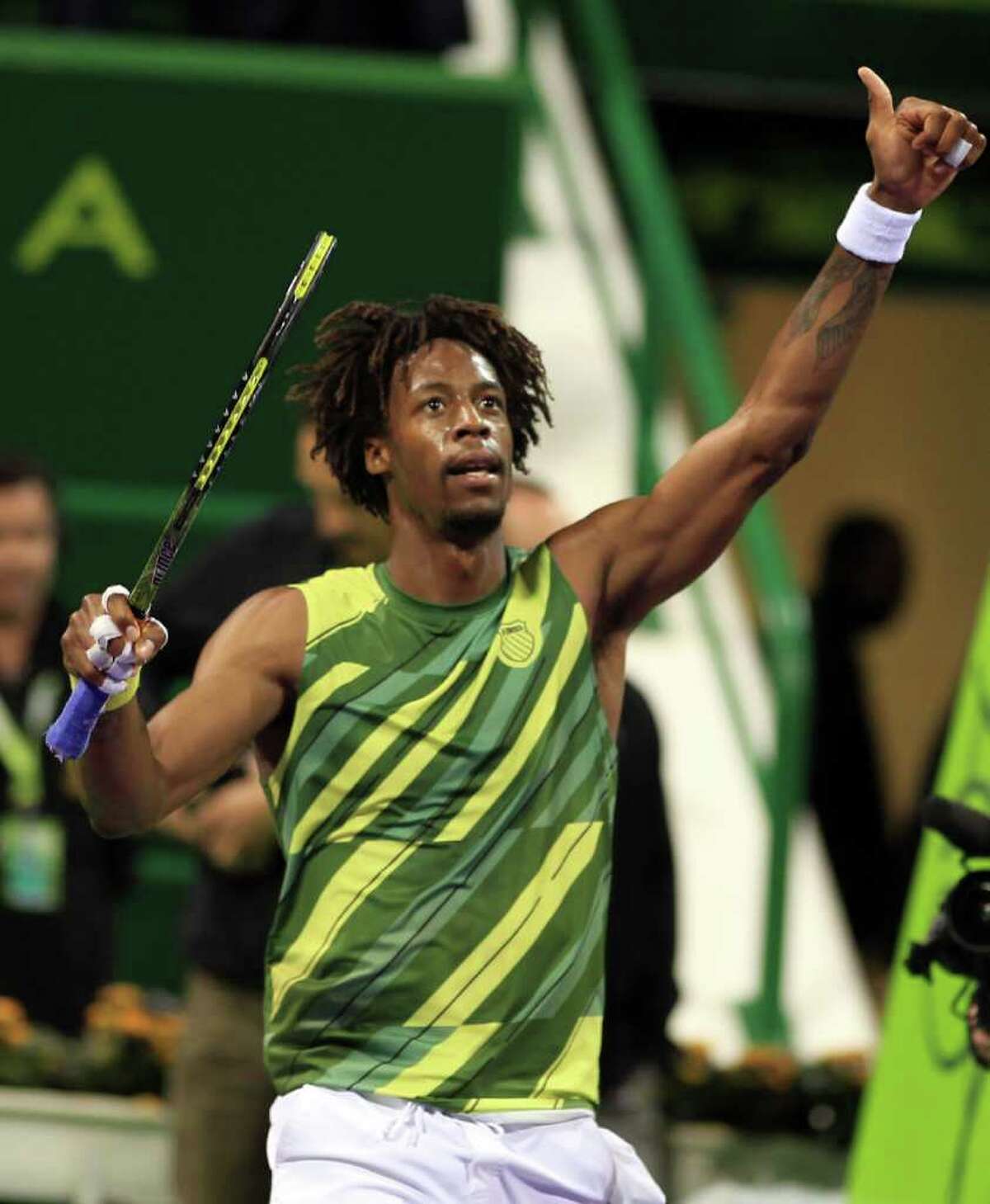 Gael Monfils celebrates after beating second-ranked Rafael Nadal 6-3, 6-4 in the semifinals of the Qatar Open in Doha on Friday.