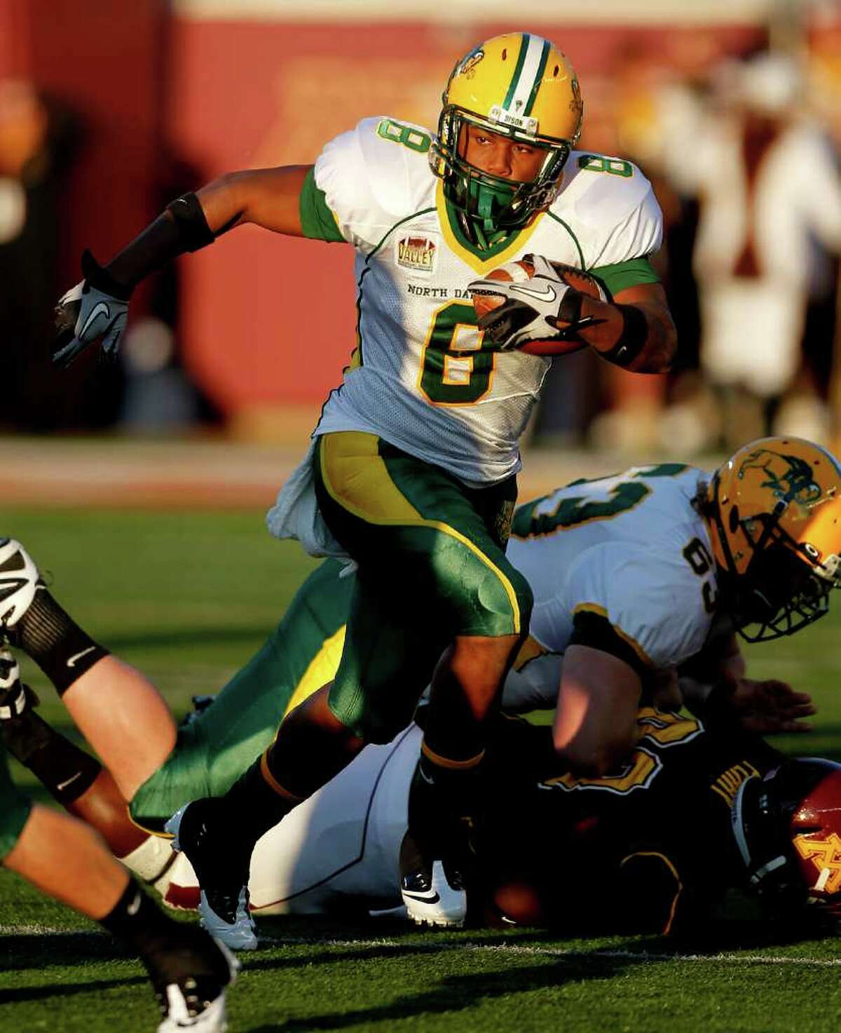 North Dakota State running back D.J. McNorton runs in the first quarter of their NCAA college football game against Minnesota, Saturday, Sept. 24, 2011, in Minneapolis. (AP Photo/Andy King)