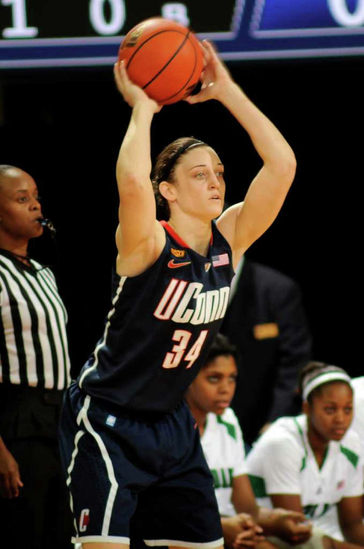 Connecticut guard Kelly Faris throws a pass during the first half of an NCAA college basketball game with Notre Dame, Saturday, Jan. 7, 2012, in South Bend, Ind. (AP Photo/Joe Raymond)