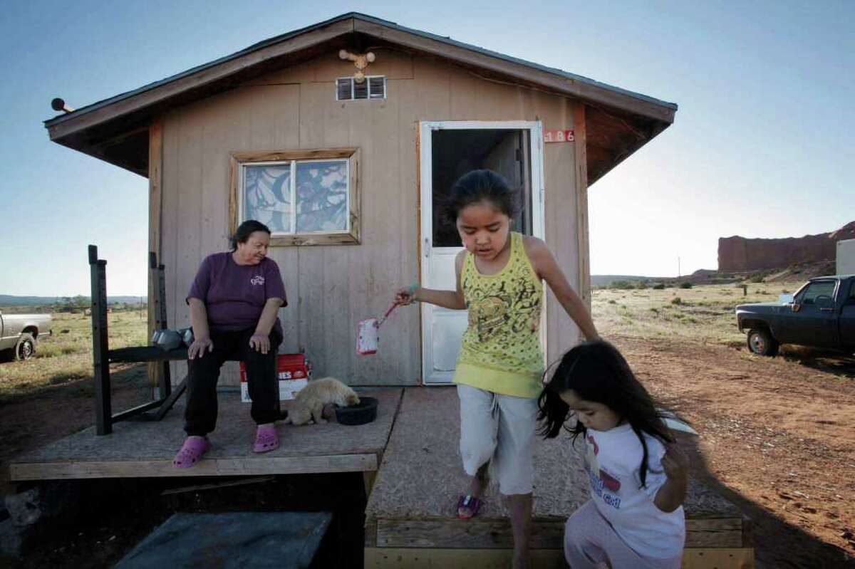 Elsie Smith, 47, lives in a small tribal community 17 miles from Gallup, N.M. When she was diagnosed, she asked the doctor, "What is HIV?" Here, Smith is pictured with granddaughters Keyanna, 7, center, and Keira, 3.