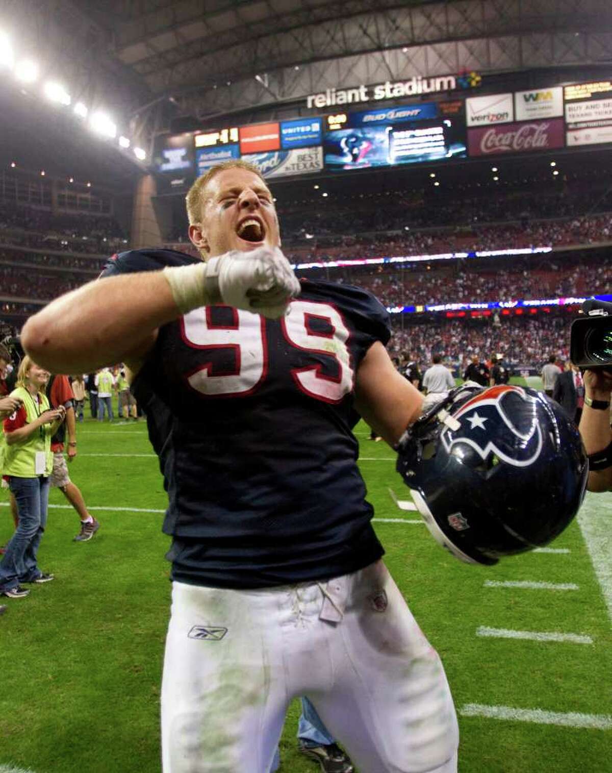 Houston Texans defensive end J.J. Watt celebrates the Texans win over the Cincinnati Bengals in an AFC wildcard playoff football game at Reliant Stadium on Saturday, Jan. 7, 2012, in Houston. The Texans beat the Bengals 31-10.