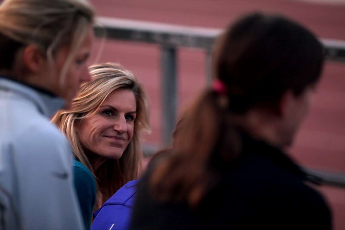 Lisbet Sunshine talks with her team about training for the Olympic marathon trials, Tuesday January 3, 2012, at Kezar Stadium in San Francisco, Calif.