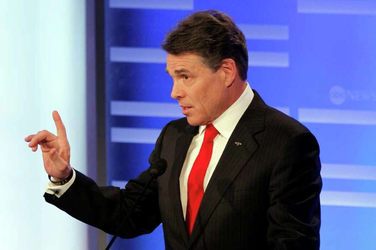 Texas Gov. Rick Perry answers a question during a Republican presidential candidate debate at Saint Anselm College in Manchester, N.H., Saturday, Jan. 7, 2012. (AP Photo/Elise Amendola)