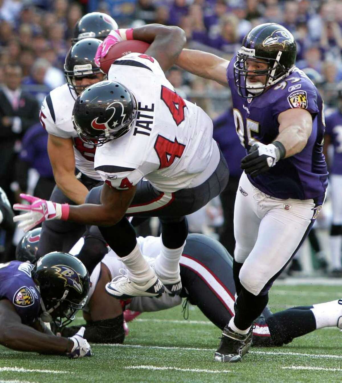 Linebacker Jarret Johnson (95) and the Baltimore defense limited Ben Tate (44) and the Texans to 90 yards rushing the last time the two teams played at M&T Bank Stadium on Oct. 16.