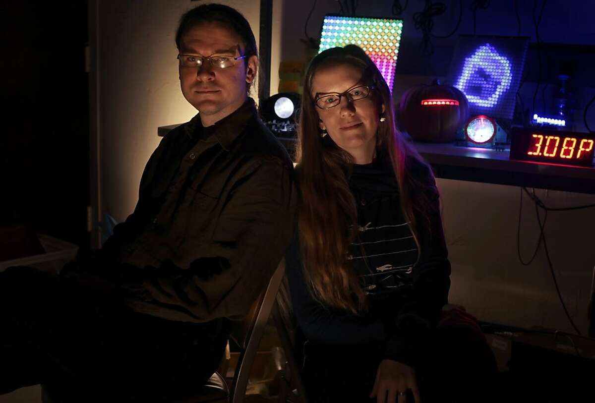 Windell Oskay and Lenore Edman creators of the evil mad scientist laboratory, Wednesday December 28, 2011, in Sunnyvale, Calif. They invent everything from itty bitty alphanumeric LED displays and hacker-friendly alarm clock kits.