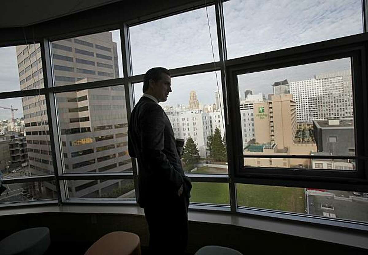 Mayor Gavin Newsom looks out the window at the view looking east down Mission Street from the Edith Witt Senior housing complex which uses a quarter of the units for homeless people. San Francisco mayor Gavin Newsom looks back on his battles against homelessness as he visits some new housing units his policies have created Tuesday December 7, 2010.