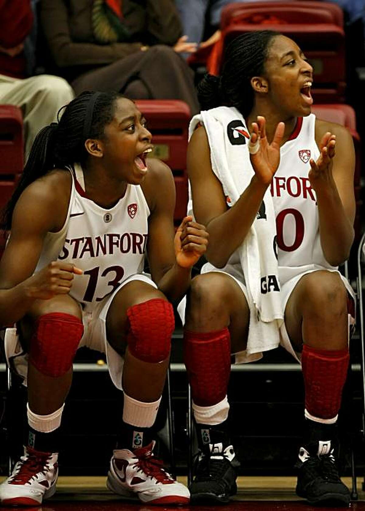 Stanford Women Cardinal Chiney and Nnemkadi Ogwumike cheer for their team against the Fresno State Bulldogs, Sunday Dec. 12, 2010, in Stanford, Calif. The sisters were the top scorers of the game with Chiney total 18 points and Nnemkadi 17, in the game.