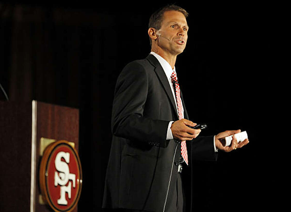 49ers Vice President of Player Personnel Trent Baalke addresses the crowd of fans at the Santa Clara Convention Center on Tuesday.