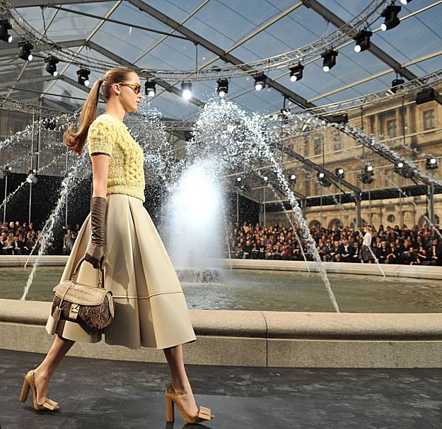 A model holds a handbag designed by Marc Jacobs for Louis Vuitton spring-summer  2011 Ready-to-Wear collection show held at the Cour Carree du Louvre in  Paris, France on October 6, 2010. Photo