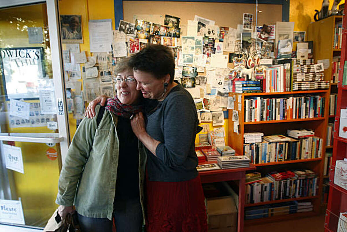 Leagrey Dimond (right) hugs longtime customer Lisa Louis at Dimond's Thidwick Books store in San Francisco, Calif., on Thursday, Dec. 23, 2010. Dimond is being forced to close her bookstore after 11 years and relocate after lawsuits were filed to force her to comply with costly ADA requirements.