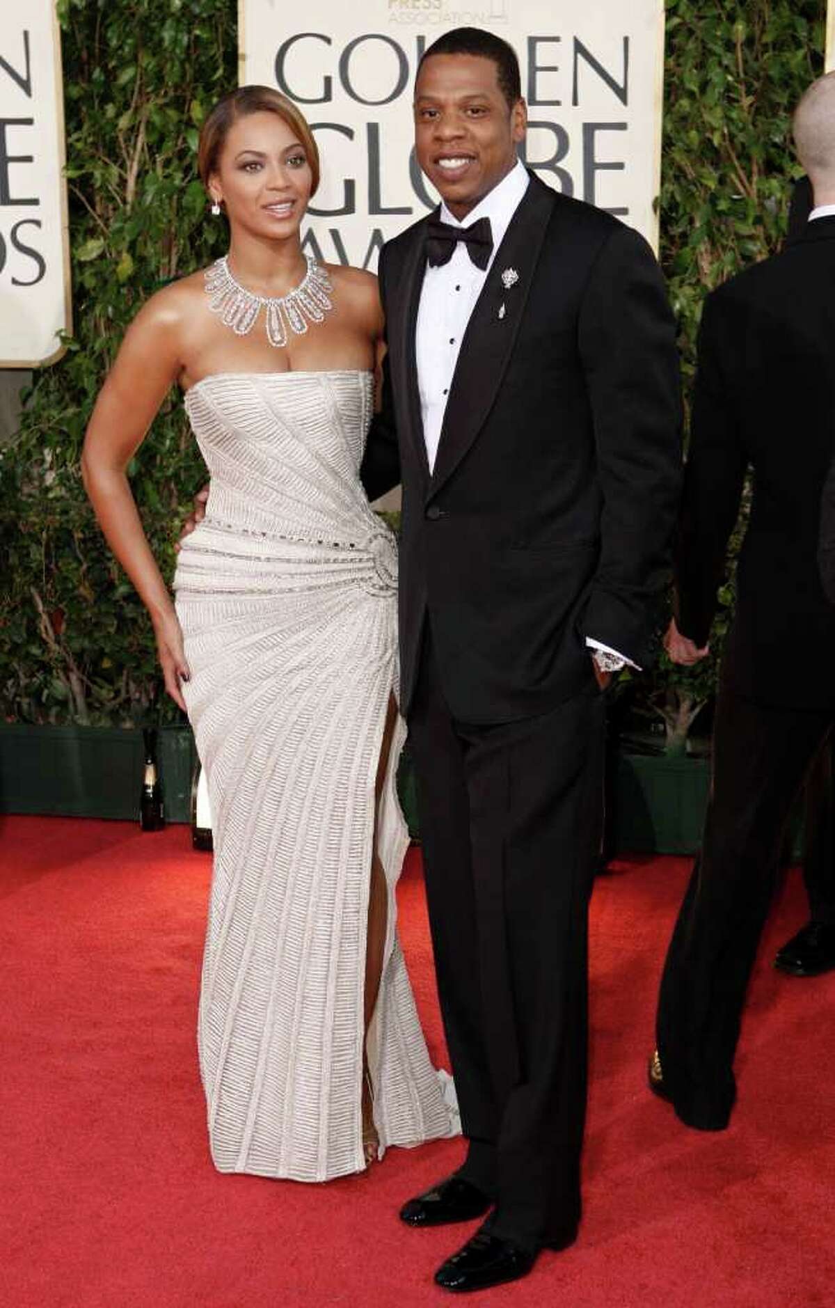 FILE - In this Jan. 11, 2009 file photo, Beyonce, left, is joined by husband Jay-Z, as she arrives at the 66th Annual Golden Globe Awards in Beverly Hills, Calif. Through a rap verse, Jay-Z has confirmed the birth of "the most beautiful girl in the world" _ his newborn daughter. The song "Glory" made its debut on his social website Monday, Jan. 9, 2012, two days after he and Beyonce reportedly gave birth to a daughter, Blue Ivy. (AP Photo/Matt Sayles, file)