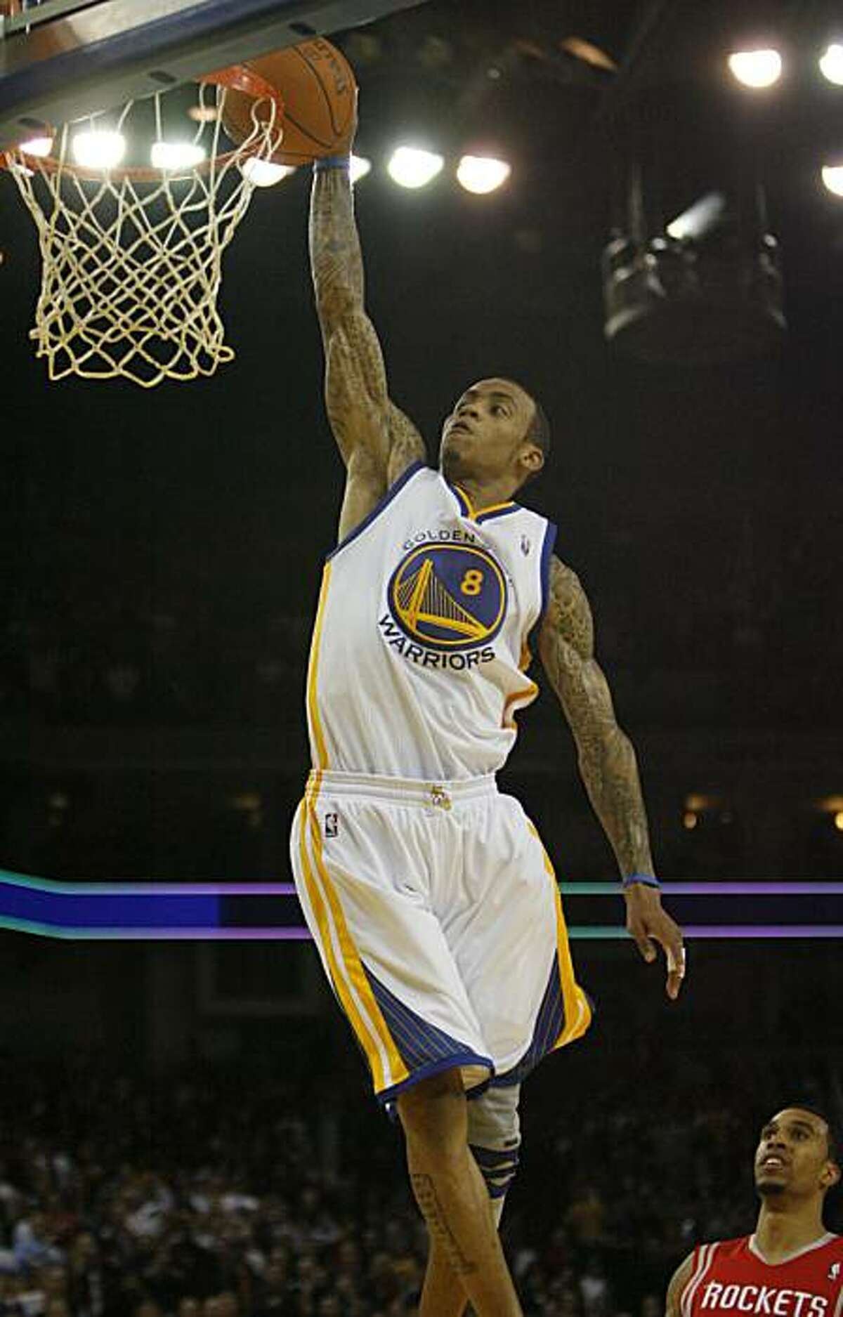 Golden Gate Warriors Monta Ellis, (8), scores against the Houston Rockets in the fourth quarter on Monday, Dec. 20, 2010 at the Oracle Arena in Oakland, Calif. The Golden Gate Warriors lose the Houston Rockets 112 to 121.