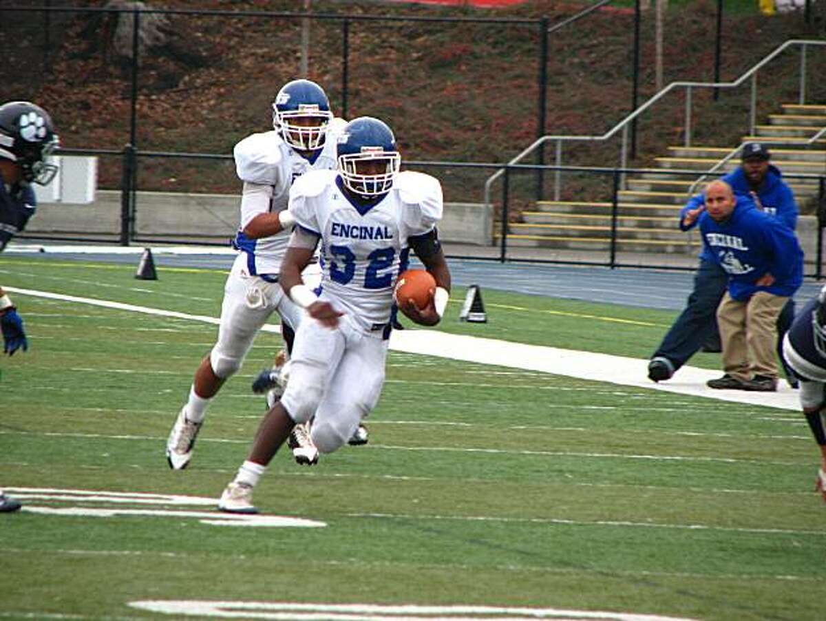 Encinal-Alameda's Jonathan Allen (32) makes a 33-yard run against Marin Catholic in the first half on Saturday, December 4, 2010.