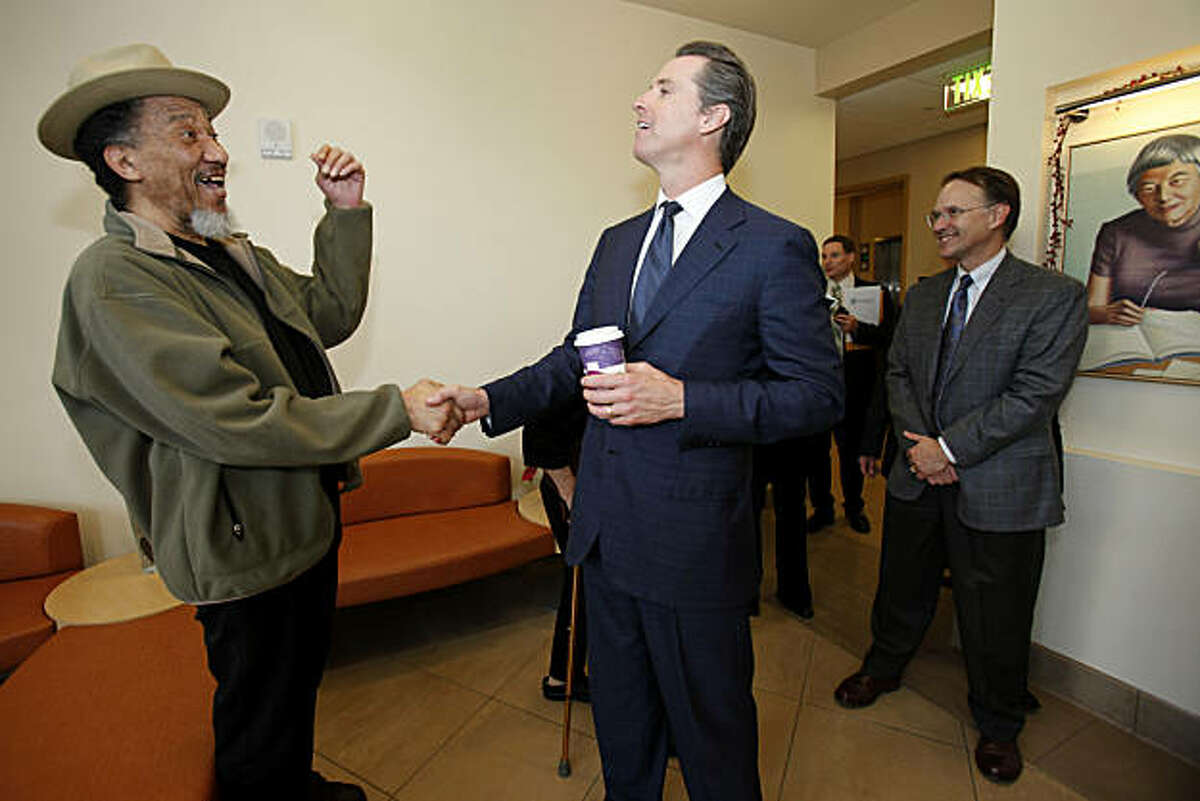 Formerly homeless man John Orr, left, is greeted by mayor Gavin Newsom at the Edith Witt senior housing complex. Orr got a room after living in Golden Gate Park for six years. San Francisco mayor Gavin Newsom looks back on his battles against homelessness as he visits some new housing units his policies have created Tuesday December 7, 2010.