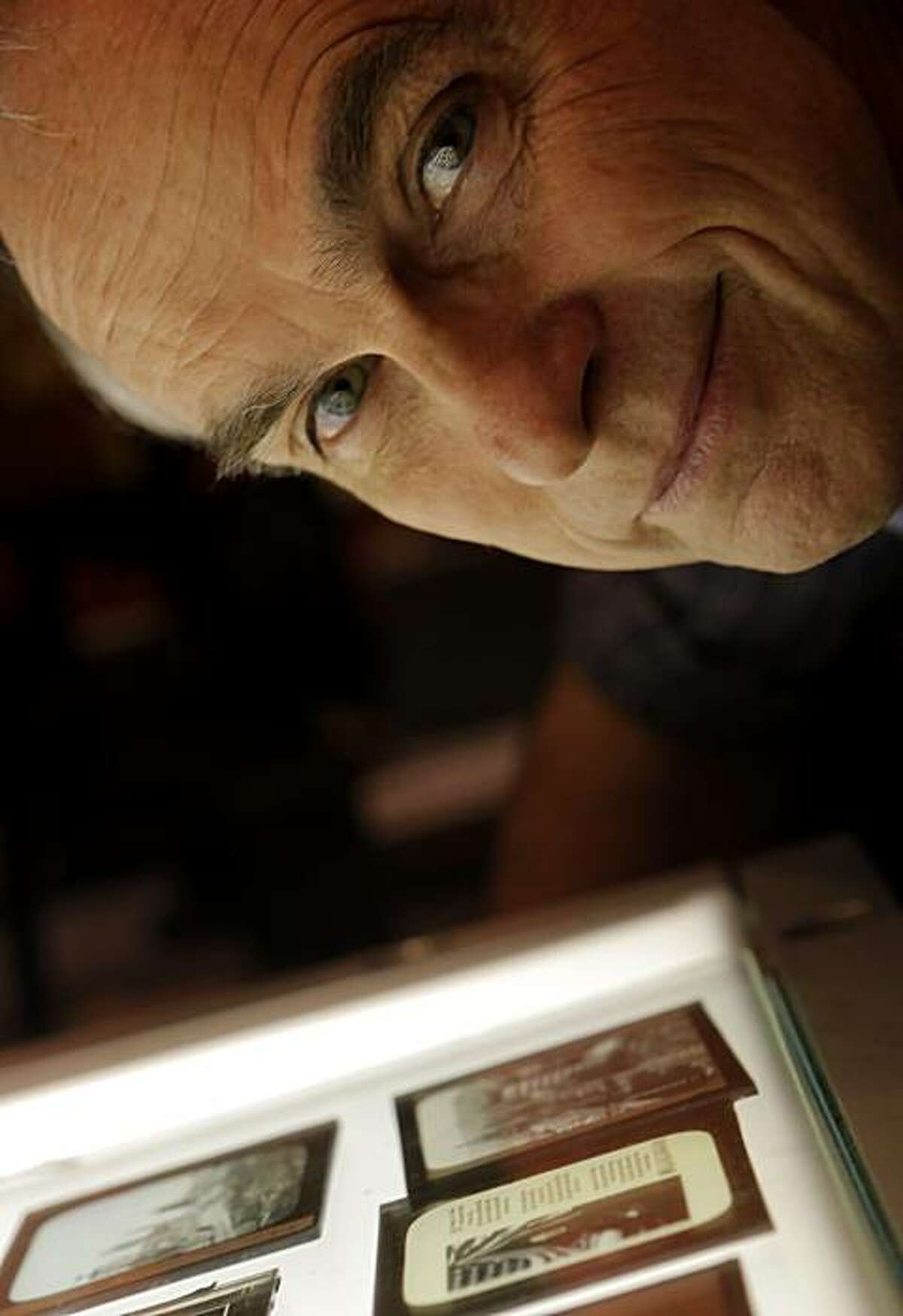 David Kiehn looks over the old glass negatives from San Francisco from 1906 at the the Niles Essanay Silent Film Museum, Monday Nov. 29, 2010, in Fremont, Calif.