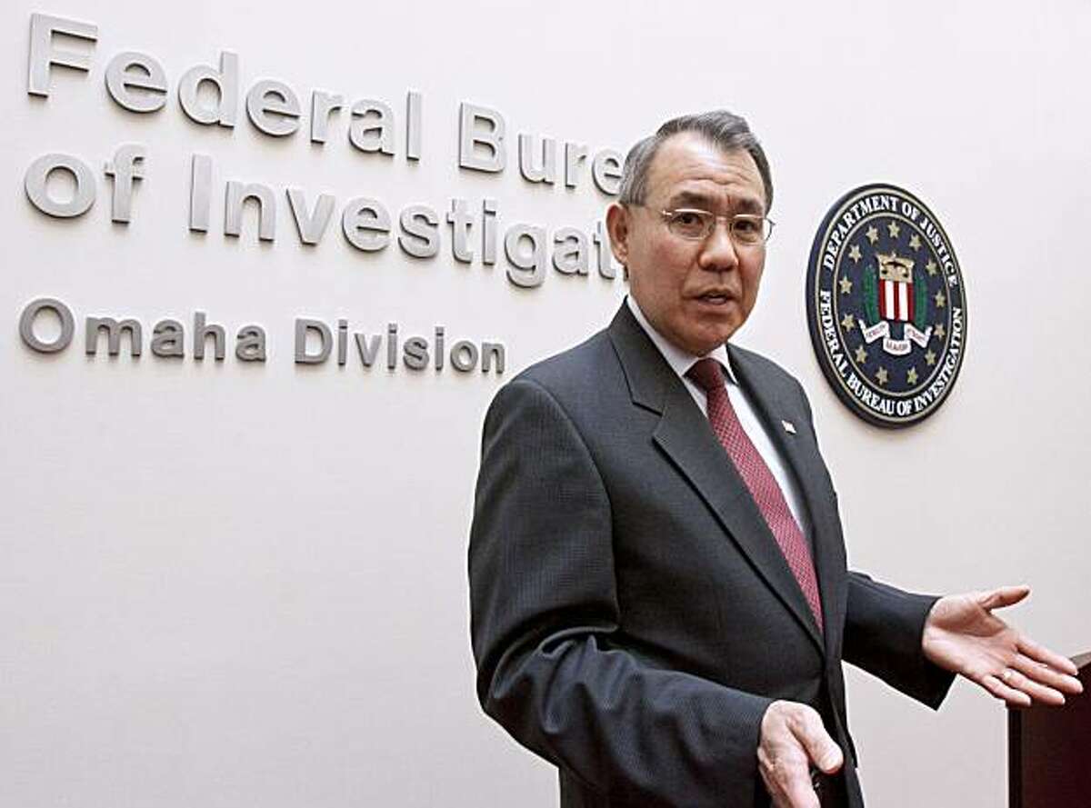 FILE - In this Oct. 1, 2010 file photo, FBI special agent Weysan Dun announces in Omaha, Neb., the arrest of more than 30 people in New York, London and the Ukraine, who are thought to belong to a cyber theft ring that netted at least $70 million. But thecourt records of Operation Trident Breach reveal a surprise: For all the high-tech tools and tactics employed in these computer crimes, platoons of low-level human foot soldiers, known as "money mules," are the indispensable cogs in the cybercriminals' money machine.