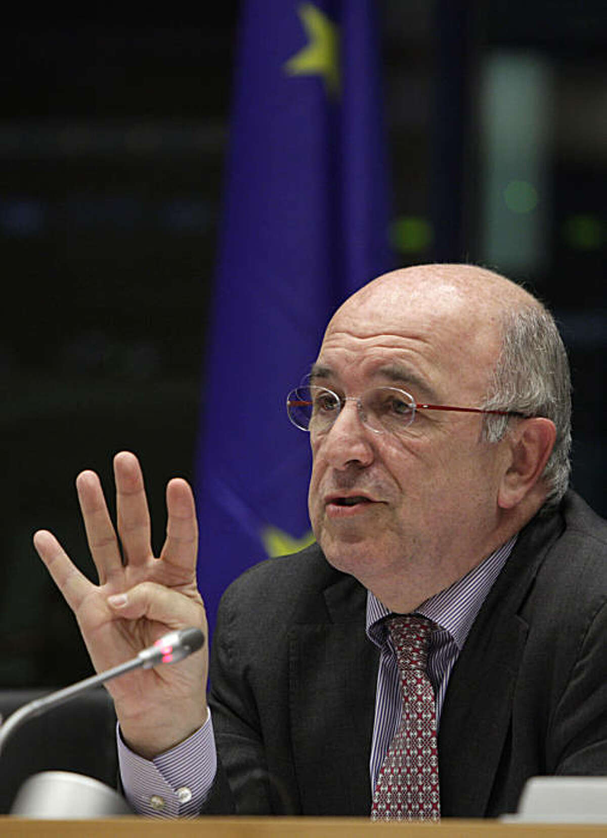 European Commissioner for Competition Joaquin Almunia gestures while speaking during a session at the European Parliament in Brussels on Tuesday, Nov. 30, 2010. The European Commission said it is launching a formal investigation into whether Google has abused its dominant market position in online searches. The EU's competition watchdog Joaquin Almunia said that the probe follows complaints from other online search providers that Google put them at a disadvantage in both its paid and unpaid search results.