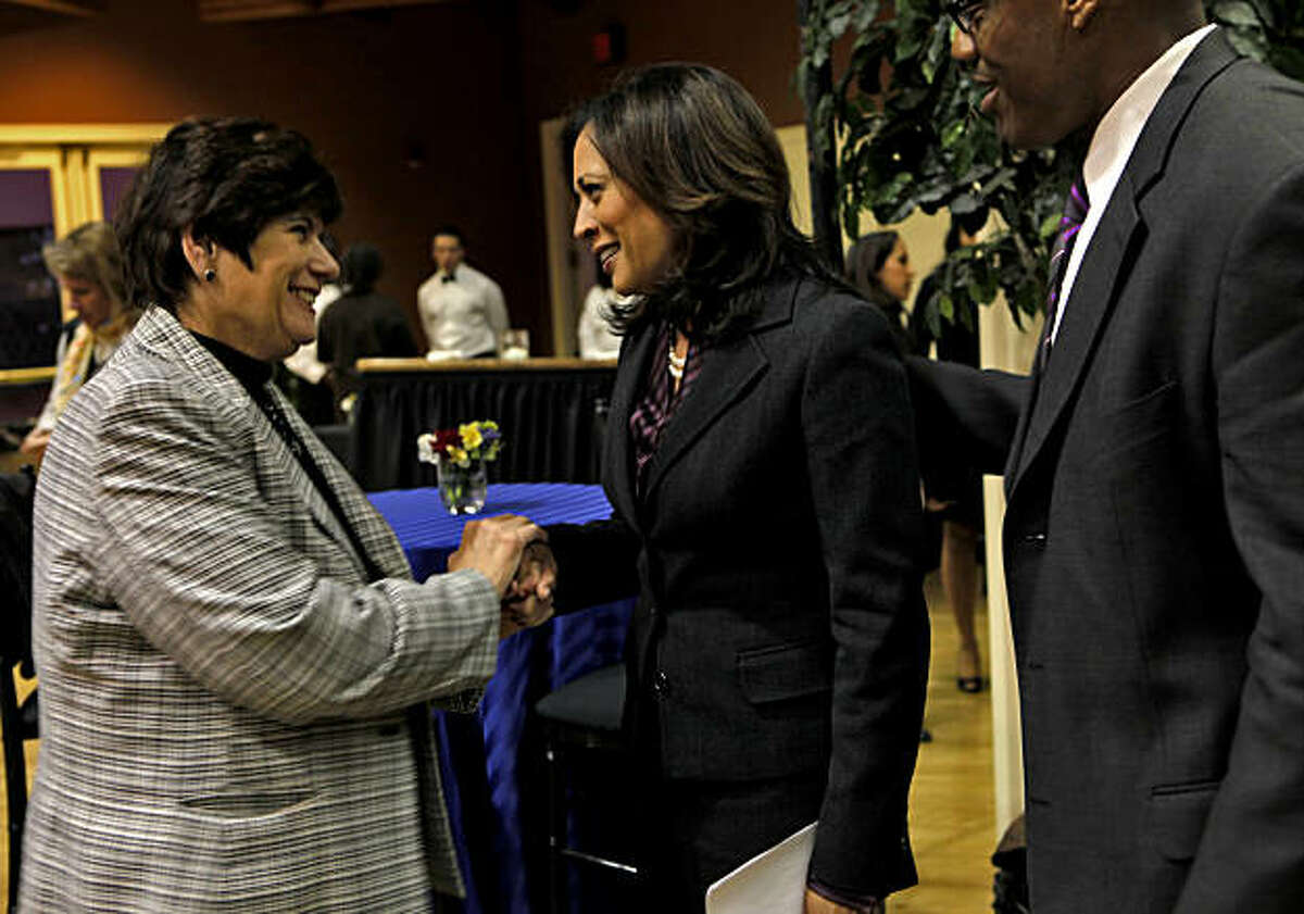 San Diego County District Attorney Bonnie Dumanis, left and J.J. Anderson, right greet Kamala Harris after a press conference announcing her victory in the Attorney General race,Tuesday Nov. 30, 2010, in San Francisco, Calif.