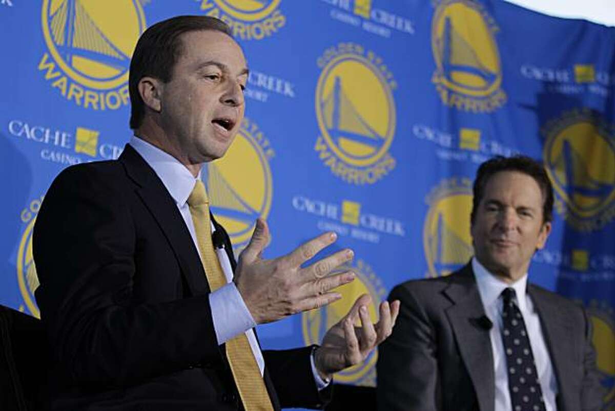 Golden State Warriors new owners Joe Lacob, left, gestures as Peter Guber, right, looks on during their introduction at a luncheon in San Francisco, Monday, Nov. 15, 2010. The sale of the Golden State Warriors NBA basketball team was completed last week to an ownership group headed by Lacob and Guber. Lacob will serve as co-executive chairman, CEO and governor and Guber will servce as co-executive chairman and alternate governor. (AP Photo/Eric Risberg)