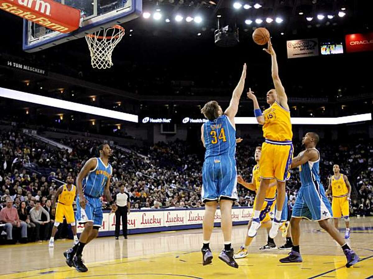Andris Biedrins puts up a shot in the first quarter. The Golden State Warriors played the New Orleans Hornets at Oracle Arena in Oakland, Calif., on Tuesday, February 15, 2011.