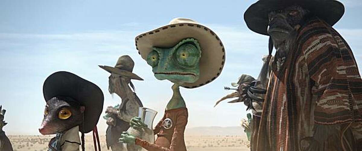 Left to right: Priscilla (Abigail Breslin), Rango (Johnny Depp), and Wounded Bird (Gil Birmingham) in RANGO, from Paramount Pictures and Nickelodeon Movies.