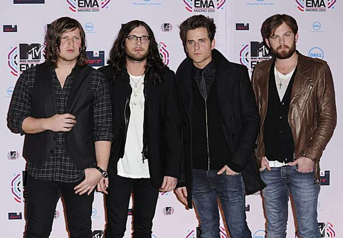 U.S. band Kings of Leon, from left, Matthew Followill, Nathan Followill, Jared Followill, and Caleb Followill arrive for the MTV European Music Awards 2010, in Madrid, Sunday, Nov. 7, 2010.