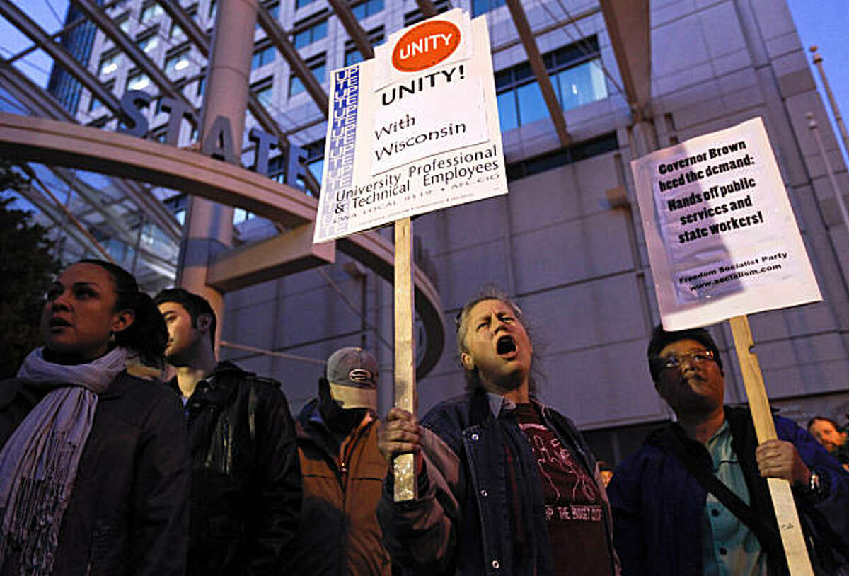 Tanya Smith, the president of the union UCB/UCOP local 1, which represents the University of California Professional and Technical Employees, yells as she joins the rally of California labor groups gathered in front of the State of California building in downtown Oakland, Ca., on Tuesday Feb. 22, 2011, showing their support for their Wisconsin comrades, who would contribute to their pensions and give up collective bargaining in a GOP-backed plan. The local union groups wonder if the same thing could happen here in California.