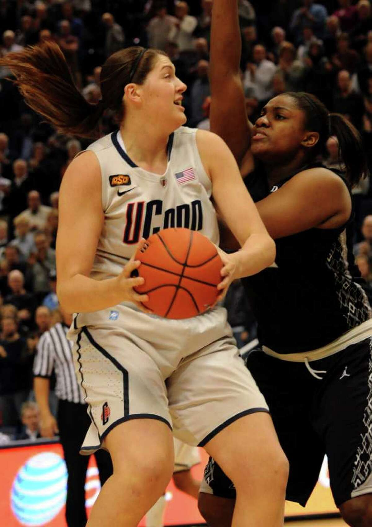Connecticut's Stefanie Dolson comes in for a sho as Providence's Lauren Okafoir defends during the first half of an NCAA college basketball game in Hartford, Conn., Tuesday, Jan. 10, 2012, in Hartford, Conn. (AP Photo/Bob Child)