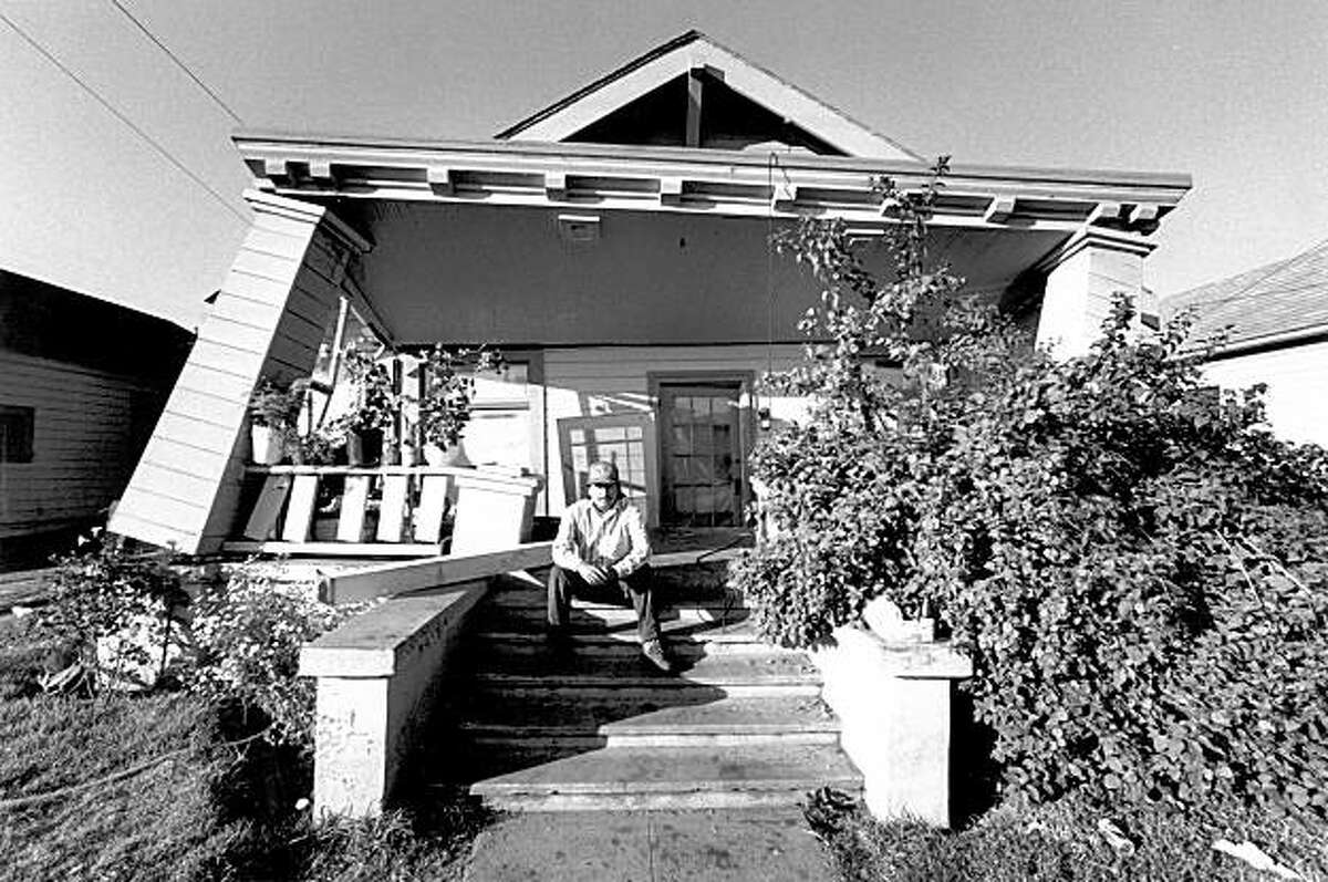 Gillermo Vega in front of his damaged home in Watsonville, Ca. after the Loma Prieta earthquake, October 17, 1989.