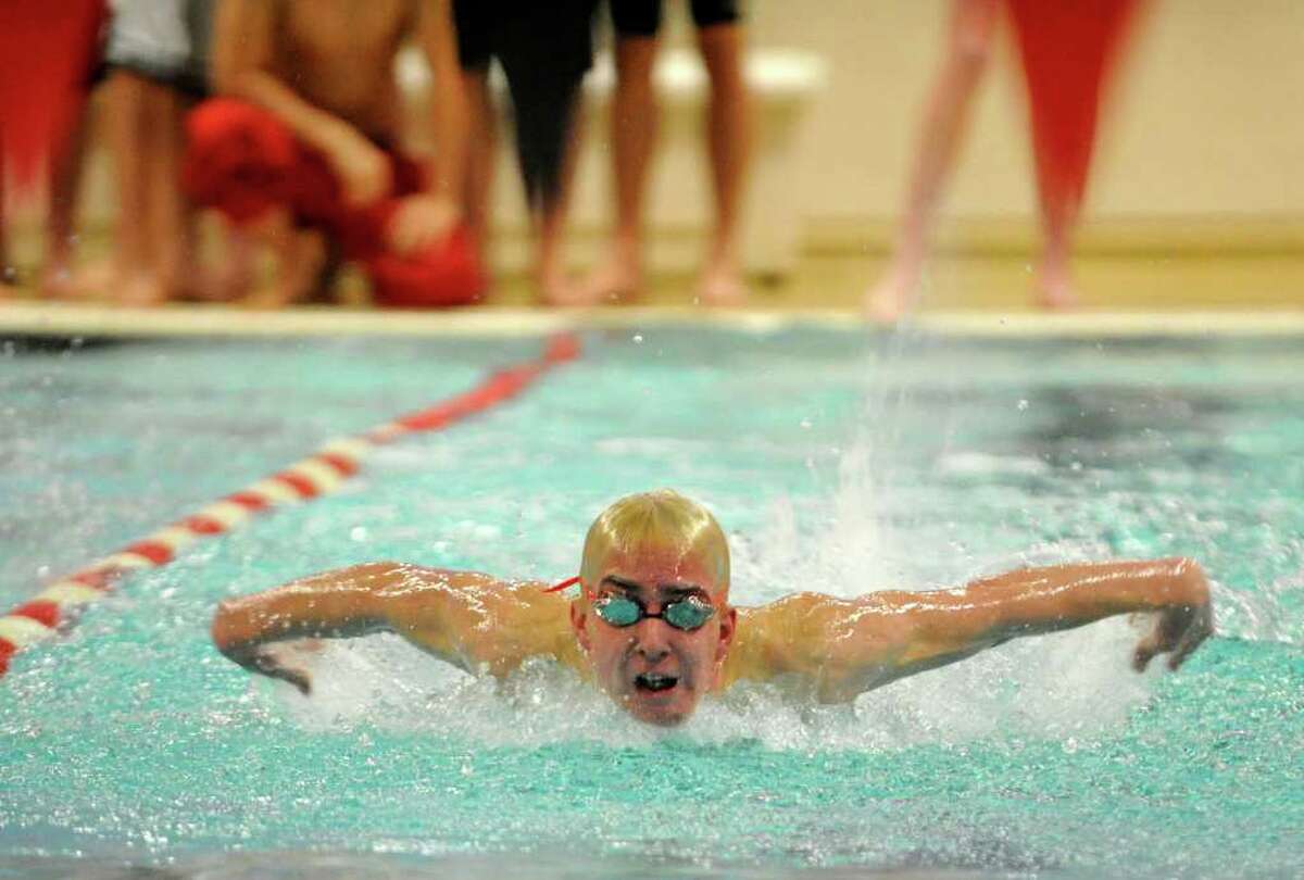 Brookfield's Jeff Magin wins the 100 meter butterfly during their meet at Pomperaug High School in Southbury on Tuesday, Jan. 10, 2012.