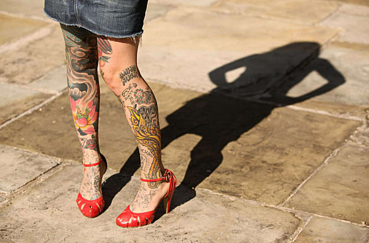 A tattoo fan has net stockings tattooed on his legs at the 19th  International Tattoo Convention in Frankfurt Main, Germany, 16 April 2011.  More than 700 tattoers from around 20 countries display