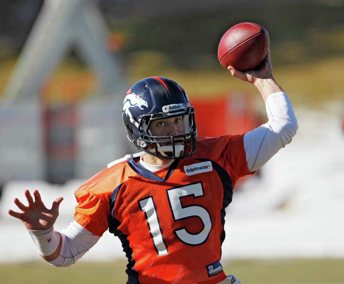 John Elway, Denver Broncos quarterback, prepares to throw the ball