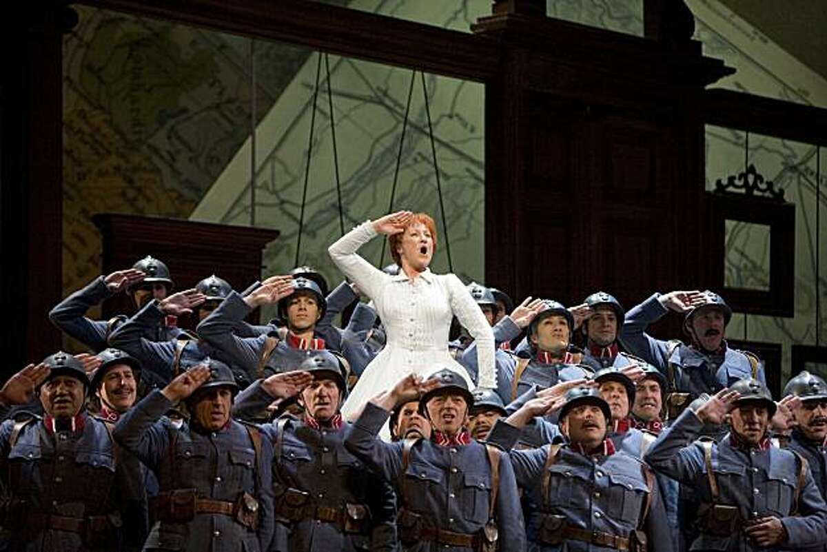 Diana Damrau (Marie) and soldiers of the 21st Regiment in Donizetti's "Daughter of the Regiment" at San Francisco Opera