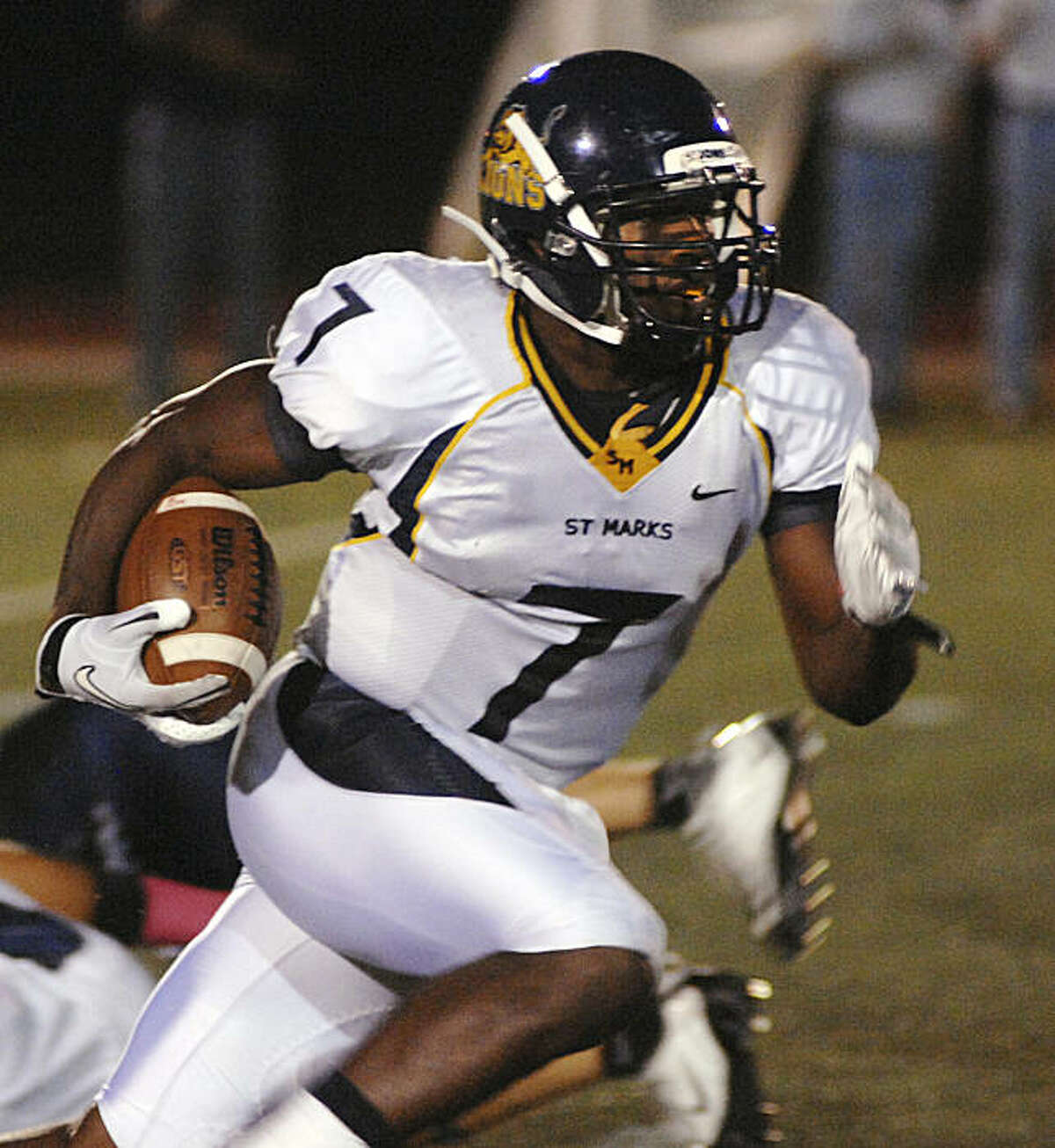 St. Mark's wide receiver, Ty Montgomery (7), carries the ball during early first quarter action Friday October 15, 2010 evening at Episcopal School of Dallas' Gene and Jerry Jones Family Stadium.