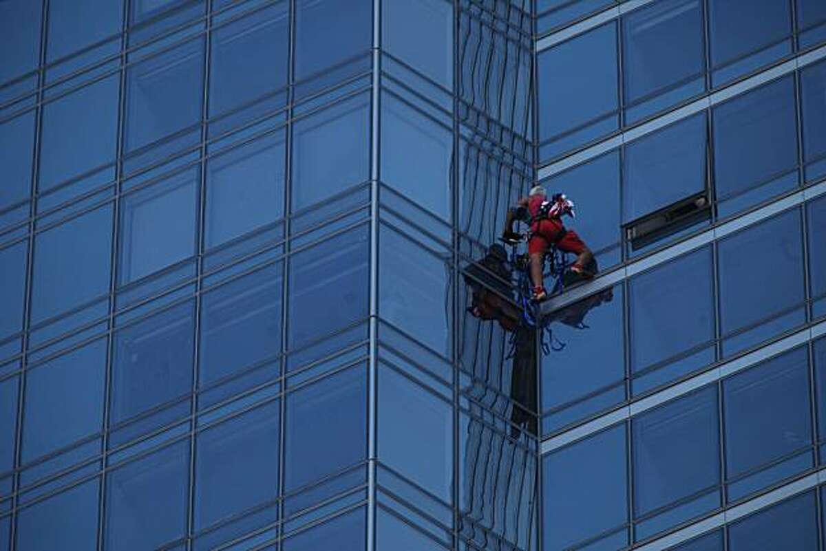 Skyscraper Man makes his way to the top of the Millennium Building on Mission Street on Monday Sept. 6, 2010 in San Francisco, Calif. After reaching the top of the 60 story glass fronted building he was arrested and will likely be charged a misdemeanor.Dan Goodwin, aka Spider Dan, makes his way to the top of the Millennium Tower on Mission Street on Monday Sept. 6, 2010 in San Francisco, Calif. After reaching the top of the 58-story glass-fronted building he was arrested and will likely be charged with a misdemeanor.