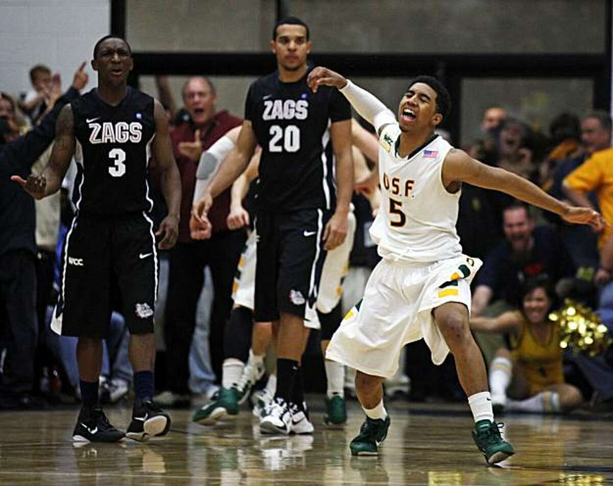 USF's Michael Williams celebrates a Gonzaga foul that sent his teammate Cody Doolin to the foul ine late into overtime. USF Don defeated the Gonzaga Bulldogs at USF's Memorial Gym in San Francisco Saturday, Jan. 22, 2011 96-91 in overtime.