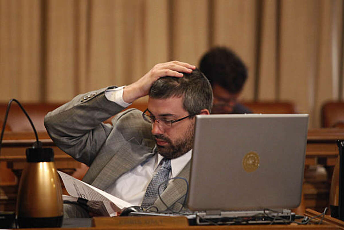 Supervisor Chris Daly studies paperwork during a San Francisco Board of Supervisors meeting at City Hall in San Francisco, Calif. on Tuesday May 4, 2010.
