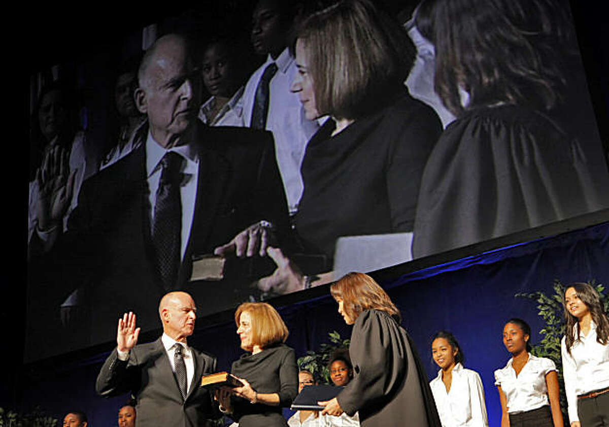 Governor-elect Jerry Brown with his wife Anne Gust Brown by his side is sworn in at Governor of California by Chief Justice Tani Cantil-Sakauye, Monday January 3, 2011, at the Memorial Auditorium in Sacramento, Calif.