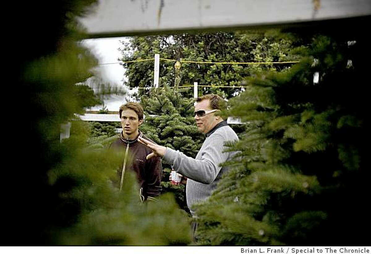 Dan Canale of San Francisco picks out his Christmas tree at The Educated Tree Christmas tree lot located at Marina Middle School. Canale's tree was the first bought at the lot on the day following Thanksgiving.