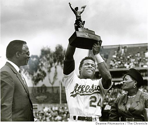 Oakland As Rickey Henderson holds third base over his head after breaking  Ty Cobbs career stole base record against the Toronto Blue Jays at the  Oakland Coliseum, Tuesday, May 29, 1990, Oakland